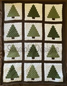 a crocheted christmas tree afghan is shown