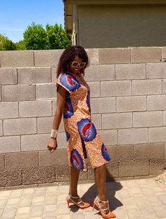 This is a unique African midi dress in a multi-print. This comfy dress will be made from Ankara fabric cut to flatter your curves.  Style is loosely cut for wiggle room.  The fabric pictured may not be available, please scroll through all photos for available fabric.   *Made to order, length is up to 40"- 42" but can be made shorter per customer request.   MEASUREMENT GUIDE: See inserted pics We are happy to answer any questions regarding measurements and styles before purchase. Note, that the customer is responsible for including their measurements or selecting the correct measurements. Where no measurements are included, we will use the listed measurements with the size selection. *️⃣FEATURES 🔸 Length Displayed = Shoulder to hem 40-42" 🔸 Model is 5'7" and wearing heels *️⃣ Colors: Whit Orange Printed Short Sleeve Midi Dress, Orange Printed Midi Dress With Short Sleeves, Multicolor Printed Vacation Dress, Multicolor Print Knee-length Dress, Multicolor Knee-length Sundress, Multicolor Beach Dresses With All Over Print, Beach Dress With Multicolor All Over Print, Multicolor All Over Print Beach Dress, Knee-length Midi Dress With Side Slits For Beach