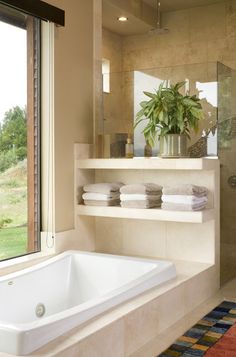 the bathroom is clean and ready to be used as a bathtub or shower stall