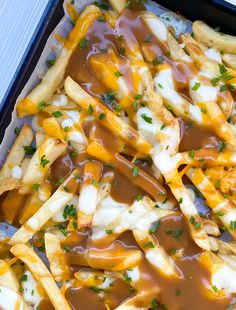 french fries covered in melted cheese and sauce