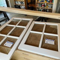 the window frames are being made and ready to be hung on the wall in the shop