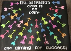 a bulletin board with colorful arrows on it and the words, yes salisbury's class is on point and aiming for success