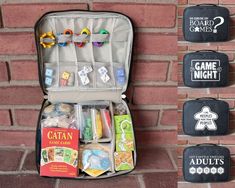 an open suitcase sitting on top of a brick wall next to some games and magnets