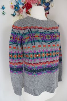 Classic multicoloured, fair isle sweater. Features lower side vents.   Please see more details below. Label - Chaps 66% cotton, 31% acrylic, 3% nylon Labelled as size small petite.  Should fit a size extra small or small. Please review measurements below for best fit as I am unable to offer returns. Shoulder seam to shoulder seam - 13" Arm length - 22.5" Chest - 34" - 37" Waist - 34" - 40" Waistband - 35" - 40" Length - 22" Pullover style. Very good vintage condition. Small amount of pilling.  I Autumn Jumpers, Vintage Hawaiian Dress, Grey Knit Sweater, Sweater Grey, Fair Isle Knitting, Fair Isle Sweater, Find You, Winter Sweaters, Fair Isle