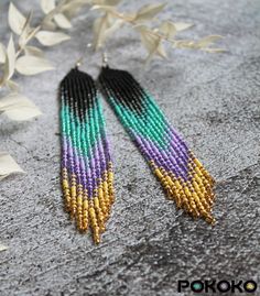 "These black turquoise purple beaded earrings pair amazingly with any outfit, dressy or casual. They will emphasize your individuality and compliment your personality on various occasions. Perfect for looking pulled together and on trend. They are made of high-quality Czech colored beads with sterling silver hooks and silicone plugs. Colors: black, turquoise, shine turquoise, purple, shine purple, yellow, shine yellow. Length: 6.3 inches (16 cm) Width: 0.8 inches (2 cm) Materials:     Czech \"Preciosa\" beads     Durable synthetic thread     Sterling silver ear hooks     Silicone plugs If you are on the hunt for a gift that will show your significant other some love, these picks are a great solution to surprise and delight. I hope you can find everything here that you were looking for. If Purple Beaded Earrings, Red Bead Earrings, Luxury Boho, Blue Beaded Earrings, Beadwork Earrings, Ombre Earrings, Goose Creek, Bead Earring, Earrings Luxury