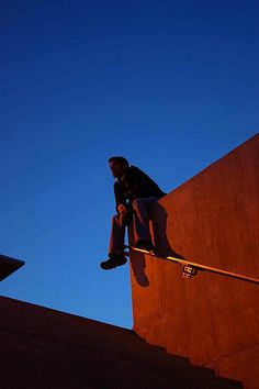 a man riding a skateboard up the side of a ramp