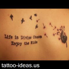 the back of a woman's shoulder with words and dandelions on it