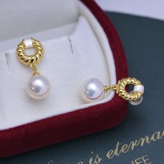 Indulge in luxurious elegance with our 9-10mm Gold Twist Pearl Earrings. The lustrous, sizable pearls showcase a captivating twist design, adding a modern and sophisticated flair. Crafted with meticulous attention to detail, these earrings effortlessly elevate any ensemble, making them a must-have for those who appreciate timeless beauty with a contemporary twist. Material: Freshwater Pearl with 925 sterling silver Product Information Pearl Type Freshwater Pearl Origin China Shape Round Quality Luxury White Diamond Pearl Earrings, Luxury Pearl Earrings With Pearl Charm, Luxury Pearl Pendant Earrings, Luxury Pearl White Pearl Earrings, Luxury White Gold Pearl Earrings, Luxury Pearl White Earrings With Pearl Pendant, Luxury Round Pearl Drop Earrings, Luxury Akoya Pearl Drop Earrings, Elegant Akoya Pearl Earrings In Pearl White