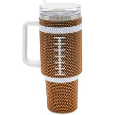 a coffee cup with a football design on the front and side, it has a white handle