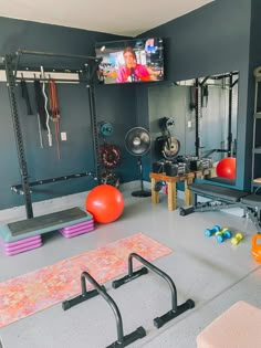 a gym with exercise equipment and yoga mats