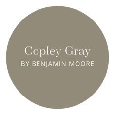 the words, copy gray by benamin moore are in white letters on a brown circle