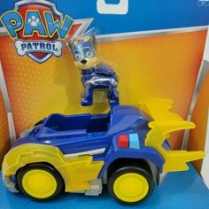 a toy car with a dog on the back in a packaging for paw patrol toys