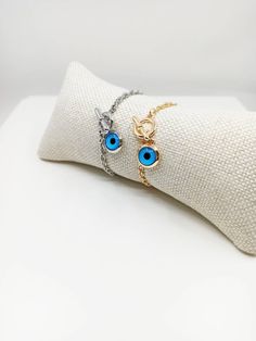 Blue eye jewelry is tarnish resistant,can't be faded in a long time. The lenght of the nazar bracelet is 18 cm(7 in) Evil eyes are believed to protect the person who carries them. They are also believed to bring good luck and deflect the negative energy. Evil eye charm bracelet can be a perfect gift choice for Christmas or birthday. 🌀Evil eye charm is over 5000 years old. It is found in all major religions and cultures. Blue evil eye or lucky evil eye is a Mediterranean amulet for protection ag Blue Evil Eye Bracelet With Adjustable Chain, Blue Metal Bracelets With Evil Eye, Blue Metal Bracelet With Evil Eye, Blue Evil Eye Metal Bracelet, Blue Round Evil Eye Bracelets, Blue Evil Eye Round Bracelets, Blue Metal Spiritual Bracelets, Blue Metal Evil Eye Bracelet, Spiritual Blue Metal Bracelets