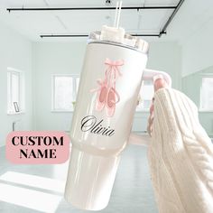 a woman is holding a personalized water bottle in her hand and the words custom name on it