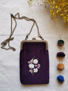 a purple purse sitting on top of a white table