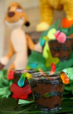 two cups with gummy bears in them on a table