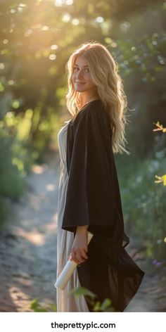 Smiling woman with blond hair standing on a forest path in sunlight, holding a book and looking over her shoulder. Graduate Photo Ideas, Graduation Pictures Nature, Graduation Photography Ideas, Grad Portraits, Outdoor Graduation Photoshoot Ideas, Graduation Pictures Ideas, Graduation Photoshoot Ideas, Grad Photo Ideas