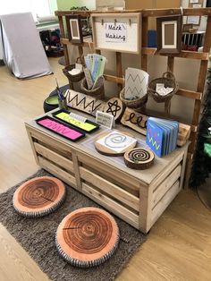 an assortment of items displayed on a table in a room with wood floors and walls