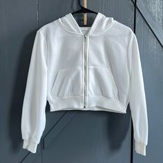 Shein White Fleece Lined Cropped Zip Up Hoodie Sweatshirt. Lightweight, Size Small. Prewashed But Never Worn. Great Condition 100% Polyester Underarm 19 1/2” Length 16” Sleeves 23” White Fleece Jacket With Pockets For Streetwear, White Hooded Fleece Jacket With Pockets, White Fleece Jacket With Ribbed Cuffs, White Fleece Jacket With Drawstring Hood For Fall, White Fleece Jacket With Ribbed Cuffs For Fall, White Fleece Sweatshirt With Pockets, White Long Sleeve Hoodie With Cozy Fit, White Cozy Fit Long Sleeve Hoodie, White Fleece Outerwear With Drawstring Hood