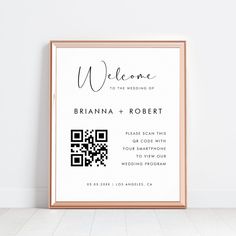 a framed wedding welcome card with qr code