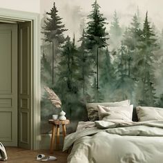 a bedroom with a forest mural on the wall