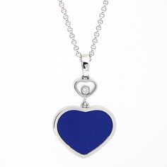 Elevate Your Elegance With The Chopard Happy Heart Lapis Pendant Necklace, A Cherished Emblem Of Love And Luxury. Crafted In Gleaming 18k White Gold, This Exquisite Necklace Showcases The Iconic Happy Heart Design Adorned With The Captivating Allure Of Lapis Lazuli. The Smaller Heart Above The Lapis Heart Features Chopard's Signature Floating Diamond, Adding A Touch Of Brilliance And Sophistication. In Excellent Condition And Without The Original Box, This Necklace Preserves Its Timeless Beauty. The Rarity Of The Lapis Version, Combined With The Signature Diamond Detail, Makes It A Genuinely Exclusive Find. Experience This Pendant's Fusion Of Sophistication And Vibrant Color To Any Ensemble. Luxury Polished Finish Heart Pendant Necklace, Luxury Sapphire Heart Necklace, Lapis Lazuli Color, Chopard Heart Necklace, Luxury Heart-shaped Jewelry With Detachable Pendant, Sapphire Gemstone Heart Pendant Necklace, Chopard Jewelry, Lapis Pendant, Happy Heart