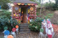 there is a small shrine in the middle of some bushes and trees with decorations on it