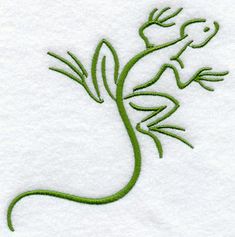 a gecko lizard embroidered onto a white towel with green thread on it's back