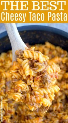 a spoon full of macaroni and cheese with meat