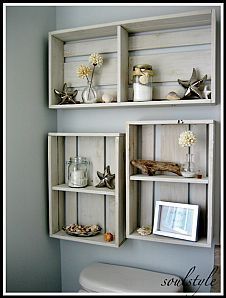 some shelves that are on the wall above a toilet