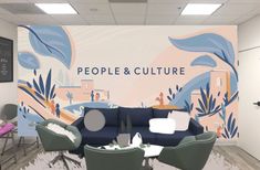 an office with a large mural on the wall that says people and culture in front of it