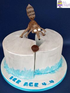 a cake that has a dog on top of it