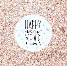 a happy new year sticker sitting on top of a pink glitter background with stars