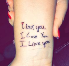 a woman's wrist tattoo with the words i love you and i love you written on it