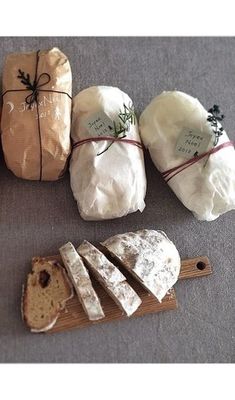 breads wrapped in brown paper and tied with twine