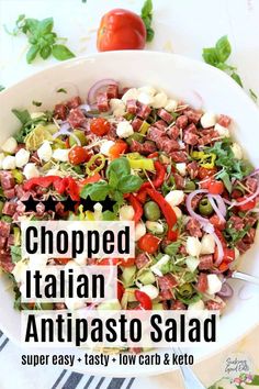 chopped italian antipasto salad in a white bowl