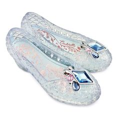 two pairs of shoes with blue and pink stones on the bottom, one in clear plastic