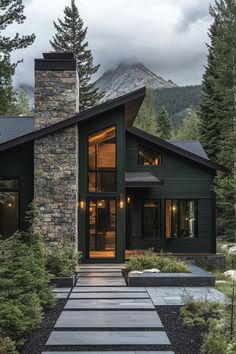 a house that is surrounded by trees and rocks