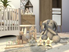 an elephant sitting on the floor next to wooden toys