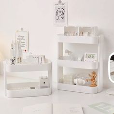 a white desk with various items on it and a mirror in the corner next to it