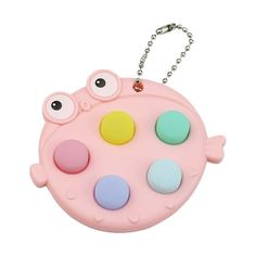 a pink toy with eyes on it and a chain hanging from the top of it