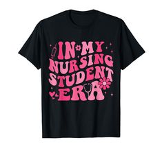 a black shirt with pink lettering that says in my nursing student era