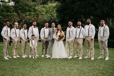 a bride and groom with their wedding party