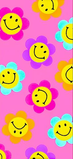 a pink background with colorful flowers and smiley faces on it's sides, as well as an image of a smiling face in the middle