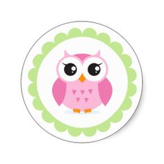 a pink and green owl plate on a white background