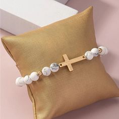 Beautiful Cross Beaded Bracelet Featuring Marble White Beads And Accents Of Small Gold Beads Size 2.4 “ Band Stretches Material- Stone White Gemstone Beads Bracelets For Beach, Adjustable White Pearl Bracelet With Gemstone Beads, White Rosary Bracelet With Colorful Beads As Gift, White Faceted Beads Rosary Bracelet Gift, Spiritual White Beaded Bracelets With Colorful Beads, Minimalist White Bracelets With Colorful Beads, White Casual Beaded Bracelets With Gemstone Beads, White Rosary Bracelet With Faceted Round Beads, Casual White Beaded Bracelet With Gemstone Beads