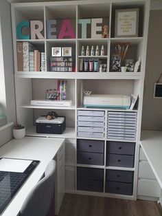 an organized craft room with lots of storage