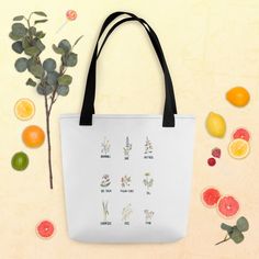 A spacious and trendy tote bag to help you carry around everything that matters.  The bag is decorated with a variety of herbs done in watercolors.  Handles can be black, red, or yellow. Great way to help the environment!  Thank you! * 100% spun polyester fabric * Bag size: 15″ × 15″ (38.1 × 38.1 cm) * Capacity: 2.6 US gal (10 l) * Maximum weight limit: 44lbs (20 kg) * Dual handles made from 100% natural cotton bull denim * Handle length 11.8″ (30 cm), width 1″ (2.5 cm) * The handles can slightl Botanical White Tote Bag, White Botanical Tote Bag, Everyday White Bags With Plants Print, White Botanical Bags For Everyday, White Botanical Style Bags For Everyday, White Bag With Plants Print For Daily Use, White Bag With Plant Print For Daily Use, White Bags With Plant Print For Daily Use, Trendy Tote Bags