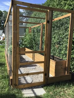 an outdoor garden area with a chicken coop