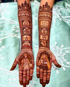 two hands with hendi designs on them